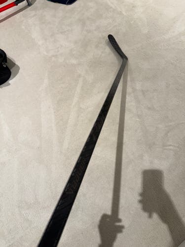 Intermediate Bauer Pulse Left Hand Hockey Stick P90TM 65 Flex Black Graphic (Used)