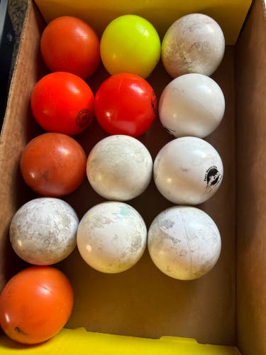 13 used field hockey balls