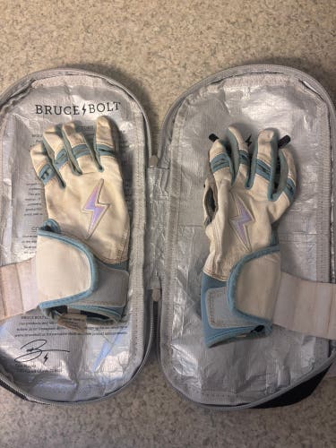 Bruce Bolt chrome series white baby blue long cuff batting gloves.