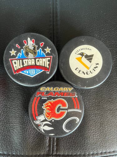 3 NHL Pucks  (Used)