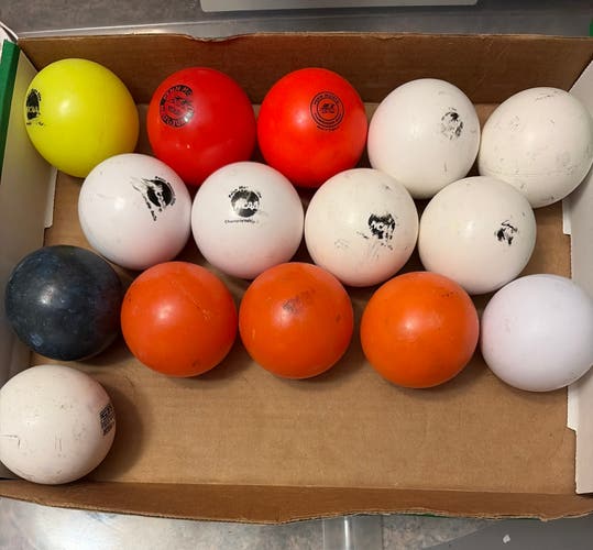 15 used field hockey balls