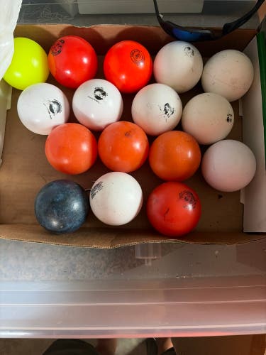 16 used field hockey balls