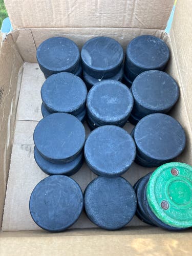 34 pucks and 1 green biscuit