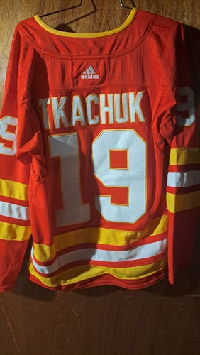 Red Calgary Flames Tkachuk  Size 46 Adult Unisex Adidas Jersey (Used)