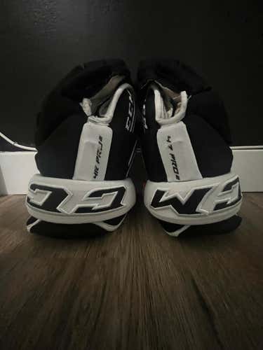 Black/White CCM Tacks 4 Roll Pro 2 Gloves 13" (Used)