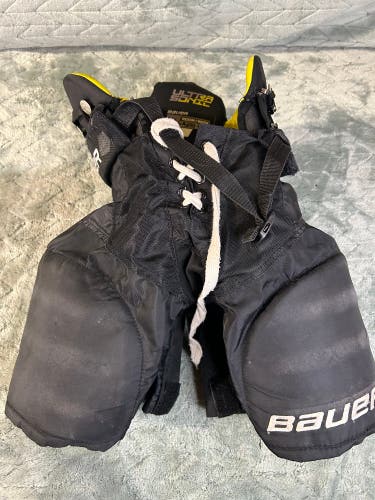 Black Youth Medium Bauer Supreme Ultrasonic Hockey Pants (Used)