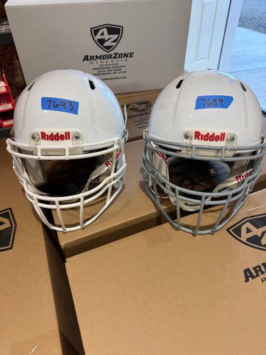 2 USED FOOTBALL HELMETS