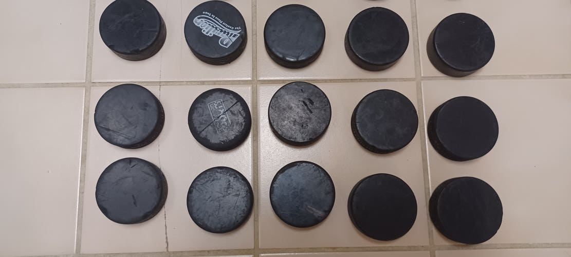 23 used but decent hockey pucks