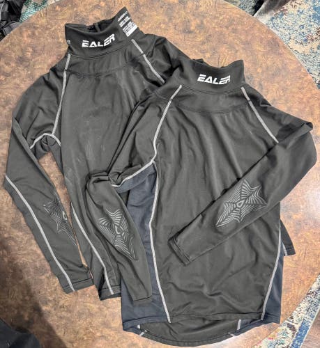 Ealer neck guard shirts (2 qty). Youth medium