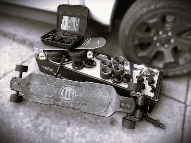 Evolve Carbon GTR Electric Skateboard with Many Accessories